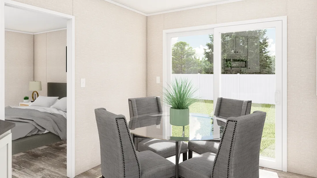 The THE ANNIVERSARY PLUS Dining Area. This Manufactured Mobile Home features 3 bedrooms and 2 baths.