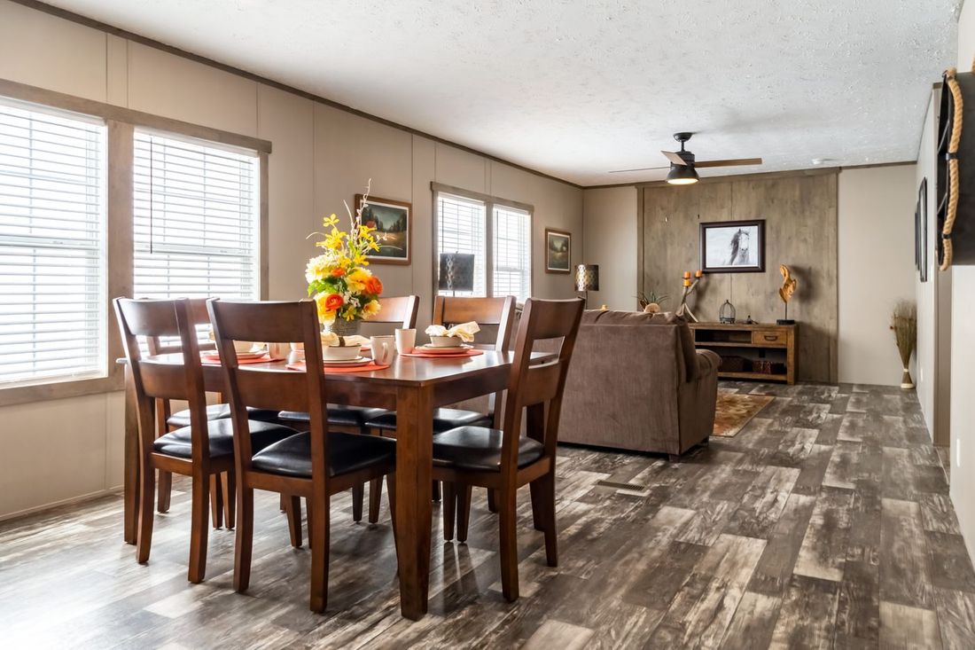 The ULTRA EXCEL 4 BR 28X60 Dining Area. This Manufactured Mobile Home features 4 bedrooms and 2 baths.