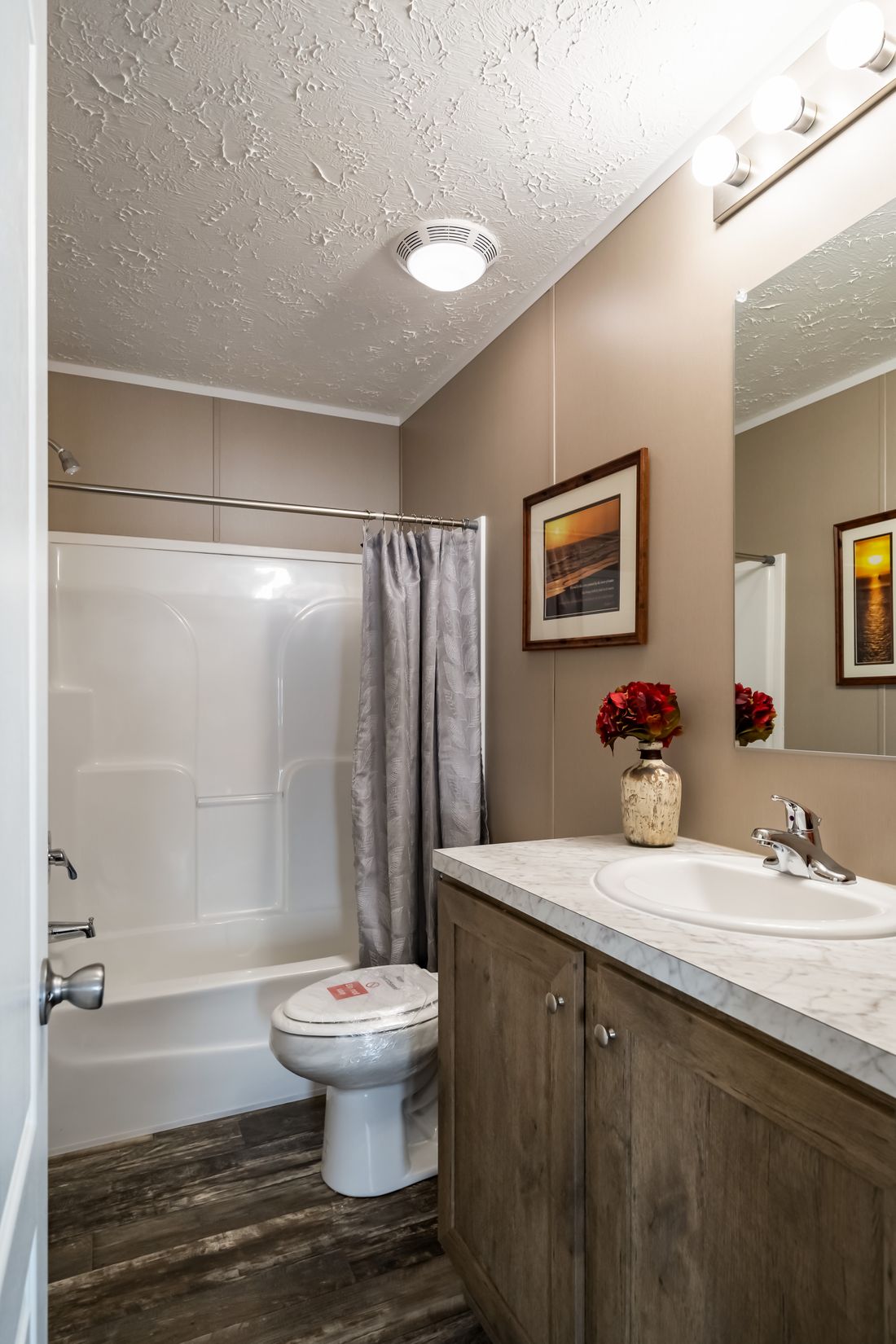 The ULTRA EXCEL 3 BR 28X60 Guest Bathroom. This Manufactured Mobile Home features 3 bedrooms and 2 baths.