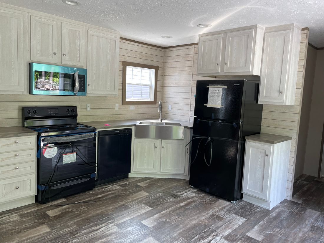 The ULTRA PRO 16X64 Kitchen. This Manufactured Mobile Home features 3 bedrooms and 2 baths.