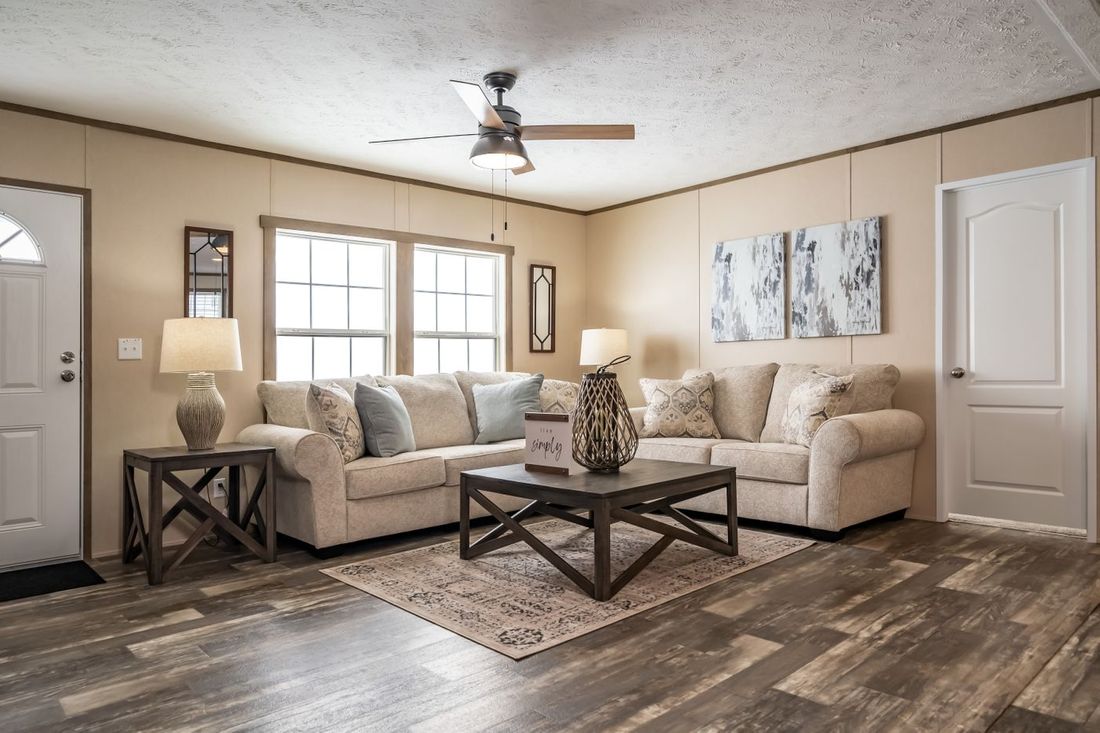The ULTRA EXCEL 4 BR 28X56 Living Room. This Manufactured Mobile Home features 4 bedrooms and 2 baths.