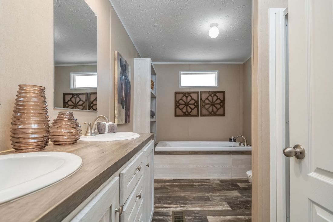 The ULTRA EXCEL 4 BR 28X56 Master Bathroom. This Manufactured Mobile Home features 4 bedrooms and 2 baths.