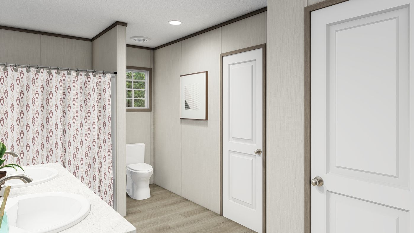 The LEGEND BIG BOY Primary Bathroom. This Manufactured Mobile Home features 4 bedrooms and 2 baths.