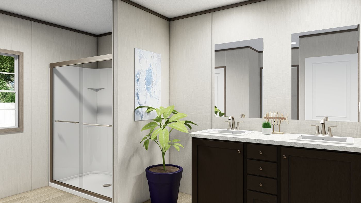 The ULTRA BREEZE 28X76 Primary Bathroom. This Manufactured Mobile Home features 4 bedrooms and 2 baths.