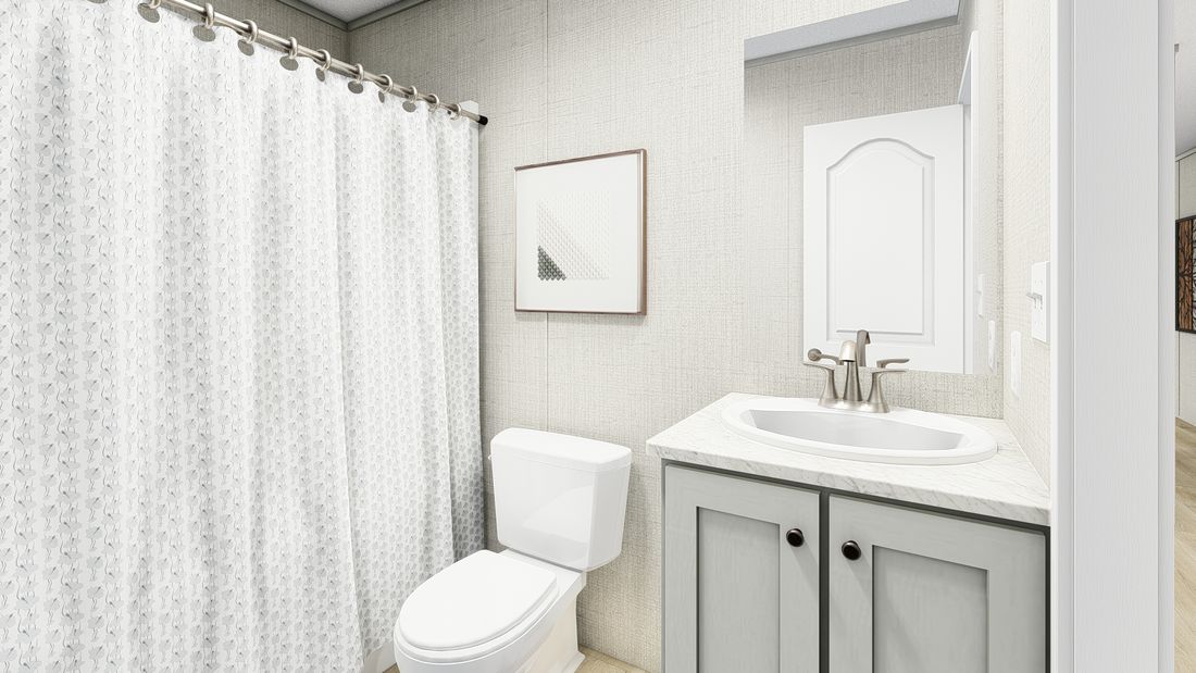 The LEGEND 16X72 COASTAL BREEZE I Guest Bathroom. This Manufactured Mobile Home features 3 bedrooms and 2 baths.