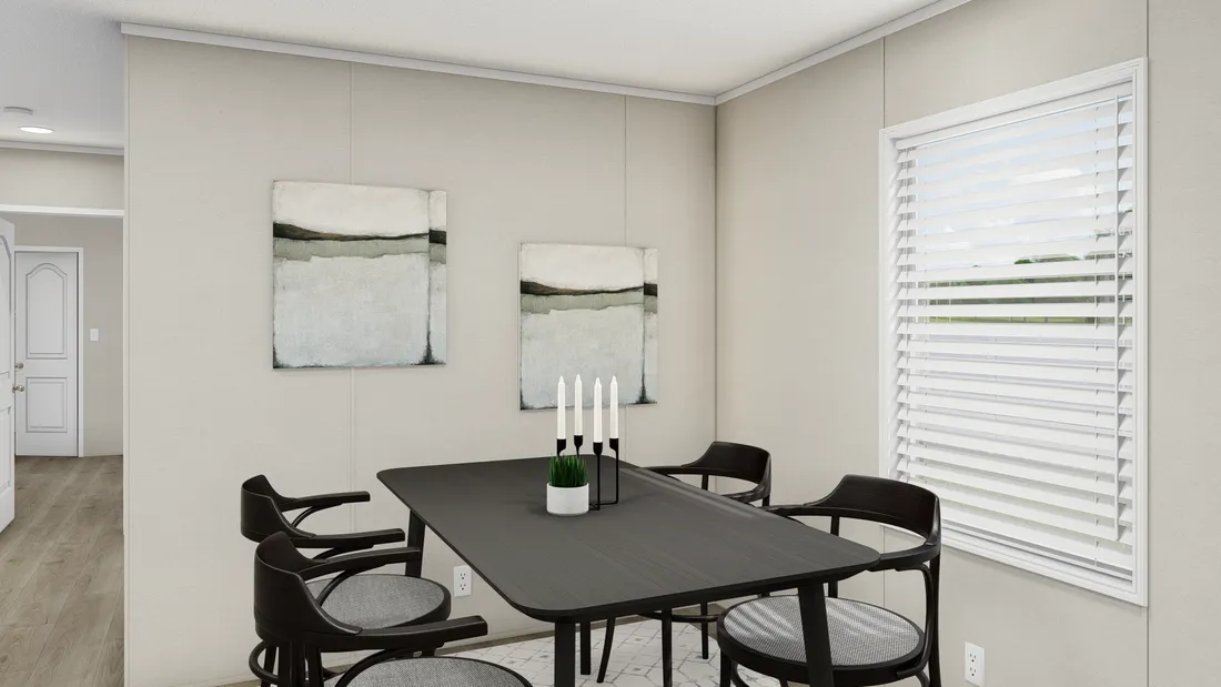 The LEGEND ANNIVERSARY 16X76 Dining Area. This Manufactured Mobile Home features 3 bedrooms and 2 baths.