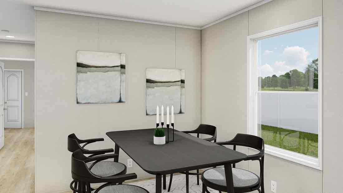 The LEGEND ANNIVERSARY 16X76 Dining Area. This Manufactured Mobile Home features 3 bedrooms and 2 baths.