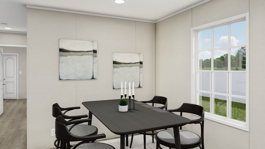 The LEGEND ANNIVERSARY 16X76 Dining Room. This Manufactured Mobile Home features 3 bedrooms and 2 baths.